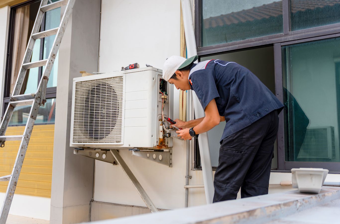 Right Guys Home Services HVAC Company technician fixing an outdoor cooling unit in Lancaster County, SC. HVAC Company Near Me.